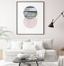 Load image into Gallery viewer, Black-framed Navy and pink Jupiter-like abstract wall art in a living room
