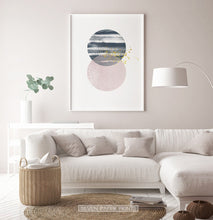 Load image into Gallery viewer, White-framed Navy and pink Jupiter-like abstract wall art in a living room
