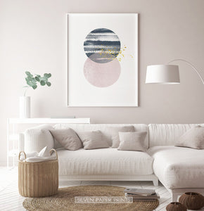 White-framed Navy and pink Jupiter-like abstract wall art in a living room