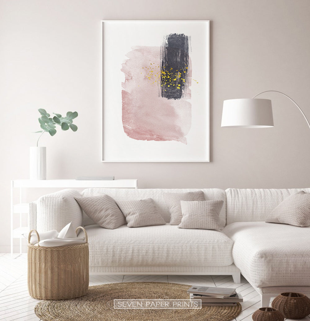 White-framed Pink and Powder stains under gold drops wall art in a living room