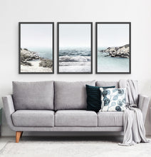 Load image into Gallery viewer, Three white shore of the ocean photos in frames above the sofa
