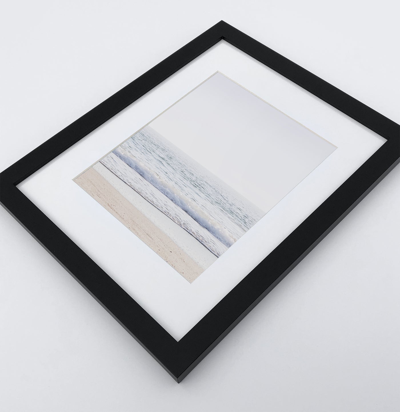 A framed photo print with ocean