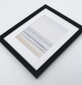 A framed photo print with ocean