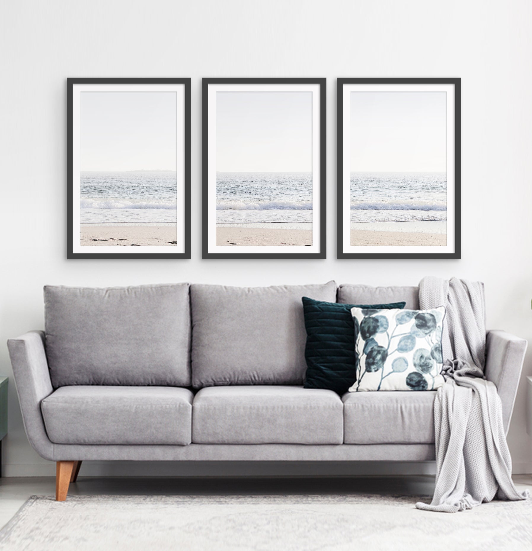 Three framed photo prints of an ocean coast