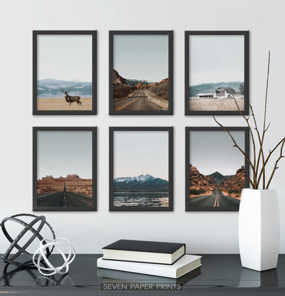 Black-framed above the black table