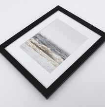 Load image into Gallery viewer, A photo print of sandy ocean shore in natural colors in a black frame
