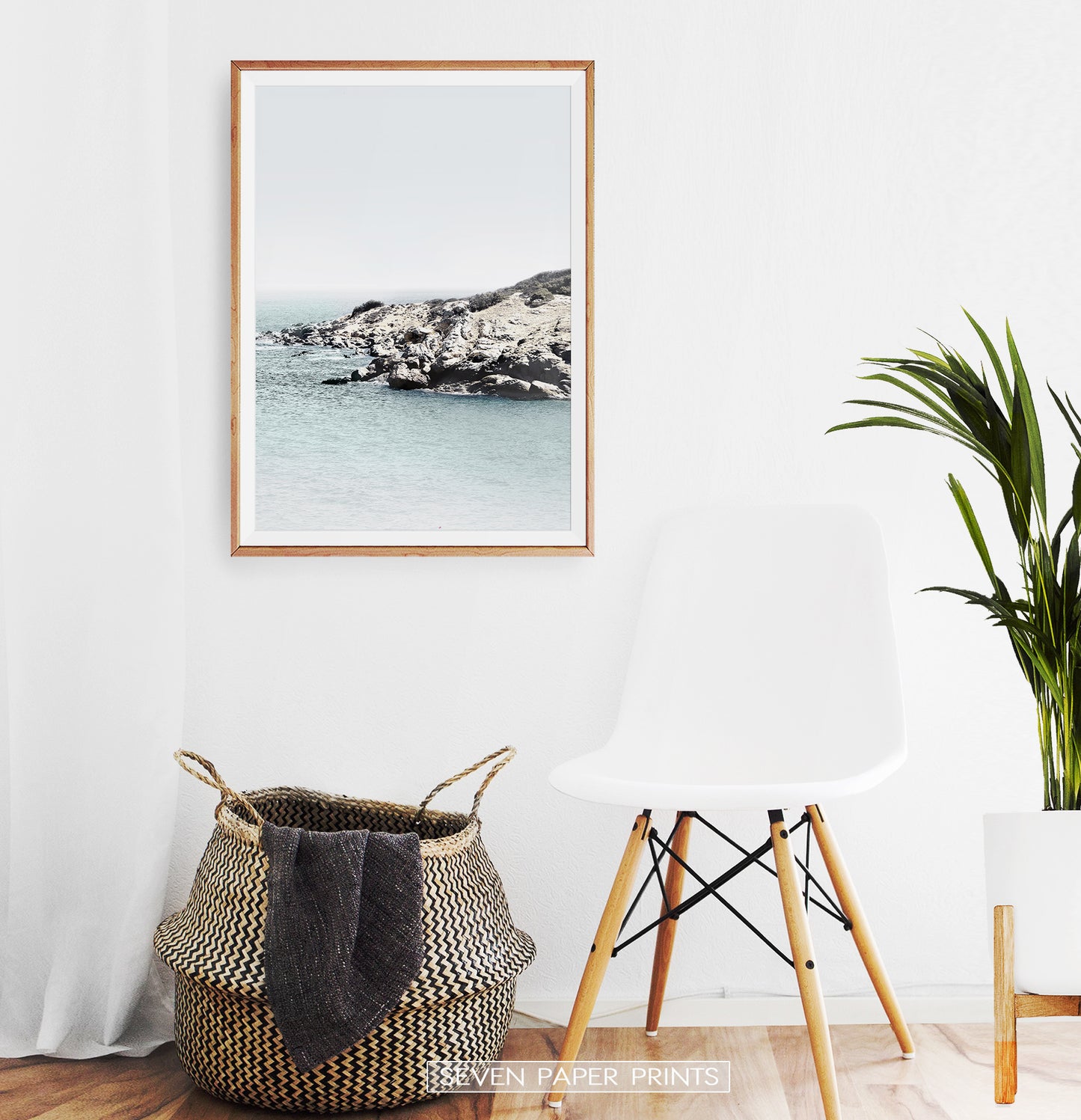 Ocean print for empty wall near the chair