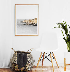 Gray Coastal Photography Hanging Above the Chair