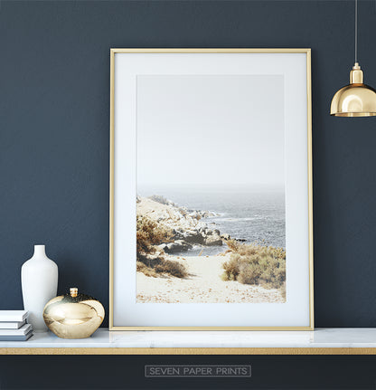 Beautiful Beach with Rocks and Gray Sea Water