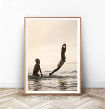 Load image into Gallery viewer, Boys Jumping Into Ocean Wall Art
