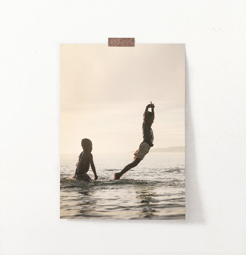 Boys Jumping Into Ocean Wall Art