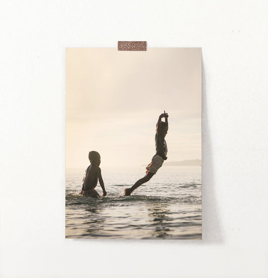 Boys Jumping Into Ocean Wall Art