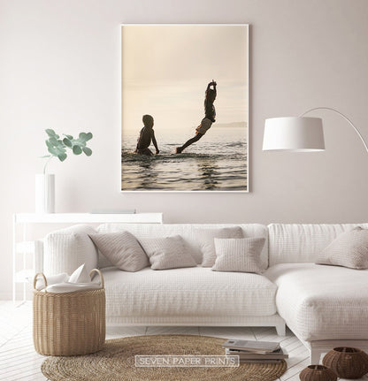 Boys Jumping Into Ocean Wall Art
