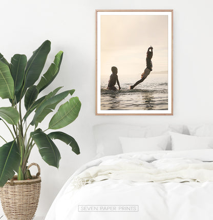 Boys Jumping Into Ocean Wall Art