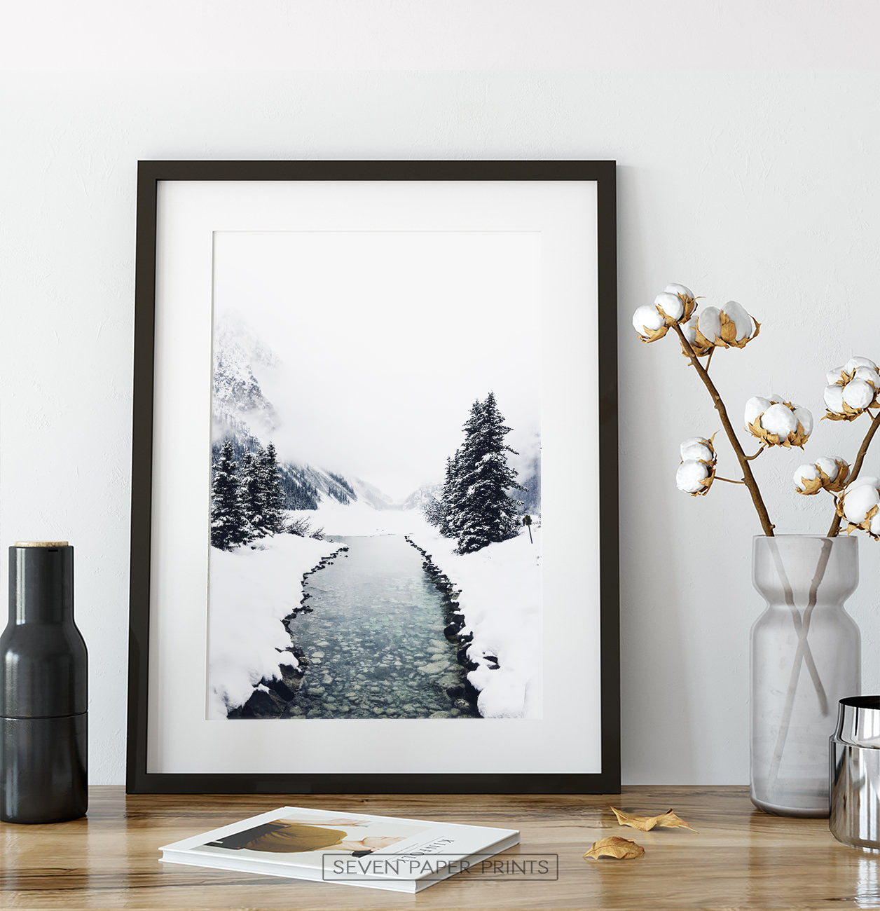 Black-framed on a wooden shelf