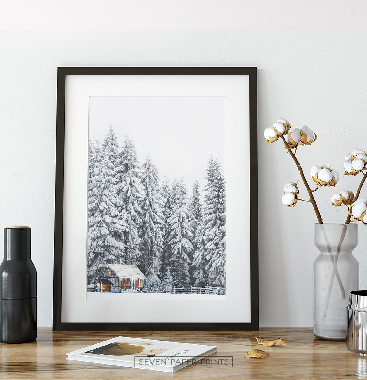 Black-framed on a wooden shelf