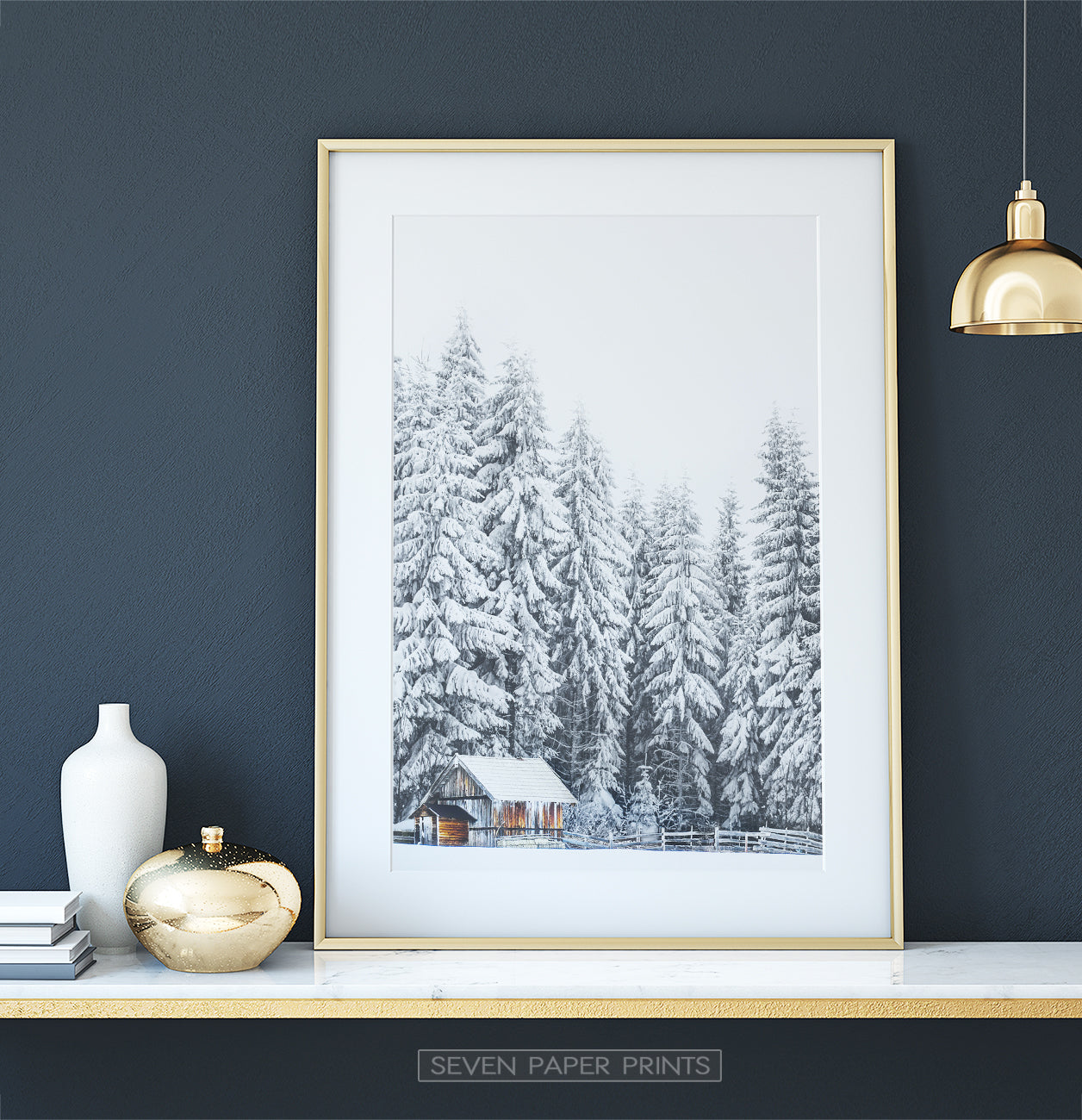 Gold-framed on white marble shelf