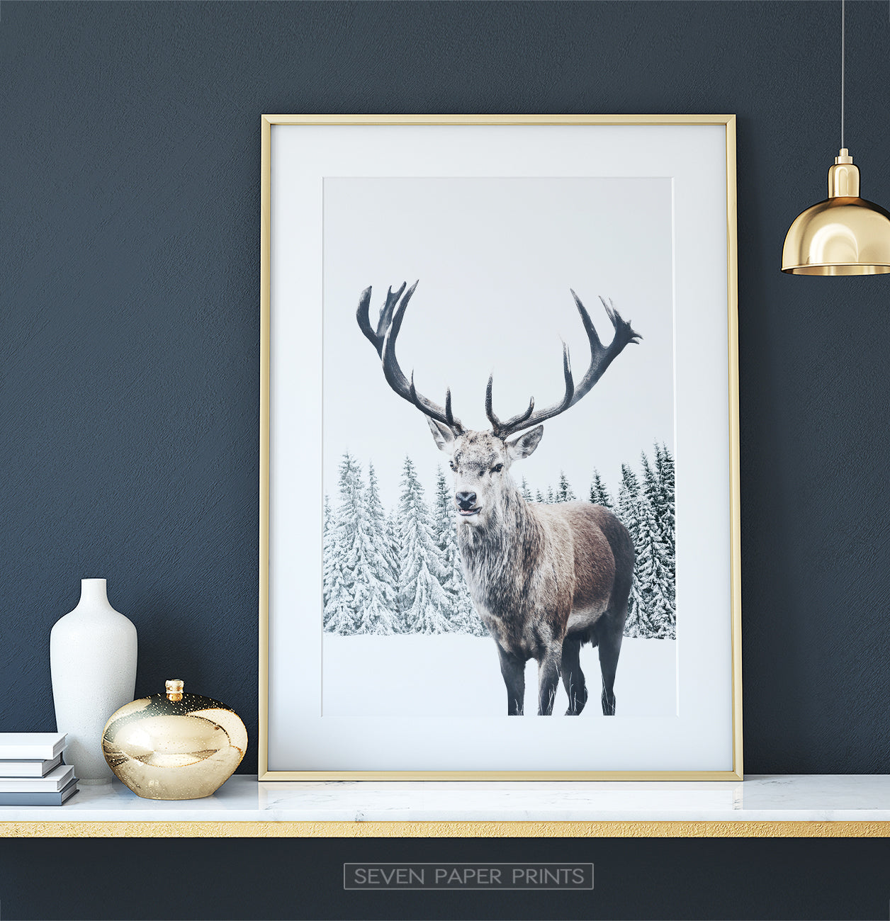 Gold-framed on white marble shelf