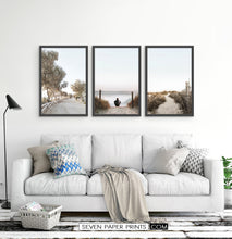 Load image into Gallery viewer, Surfer Sitting on the Sandy Beach. 3 Piece Framed Wall Art
