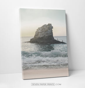 A stretched canvas of an ocean shore with a cliff