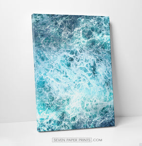 A stretched canvas of white sea waves and foam on dark blue ocean 3