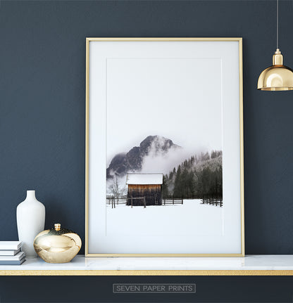 Golden-framed on a white marble shelf