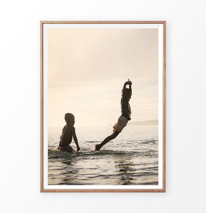Boys jumping into the sea, summer fun photograph